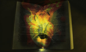 Image composite of book and light using original photographs from unsplash.com